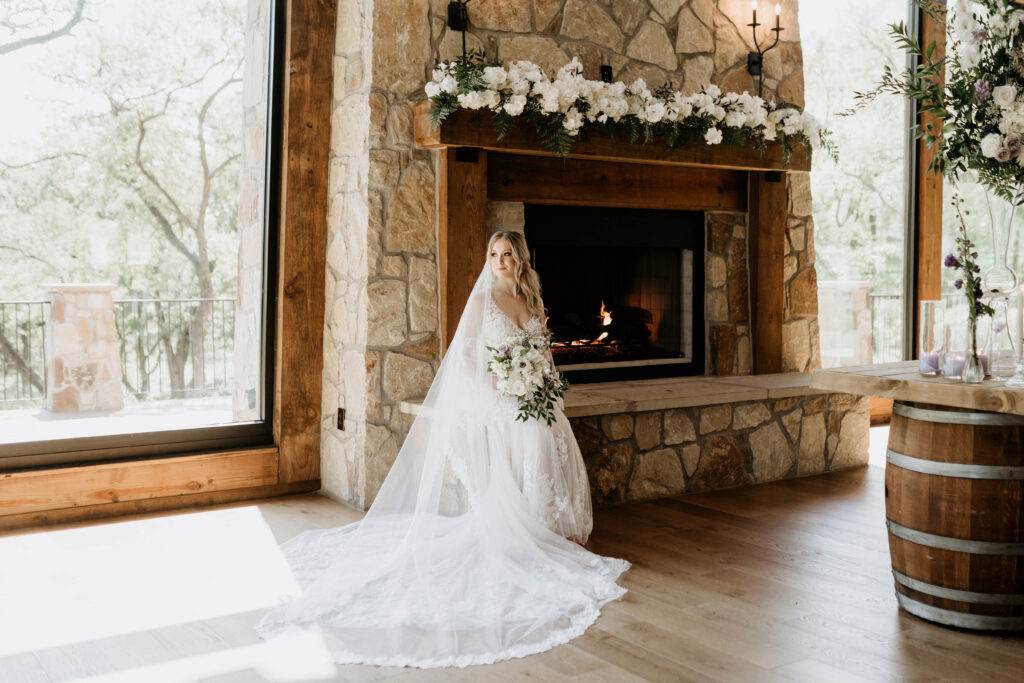 Alvarado Wedding Venue Bride with Veil Roses Fireplace and Natural Light Lodge